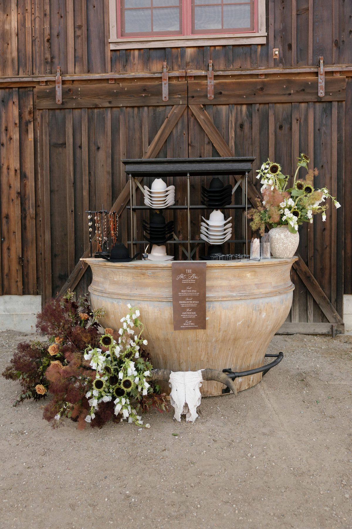 The hat bar against the timber barn