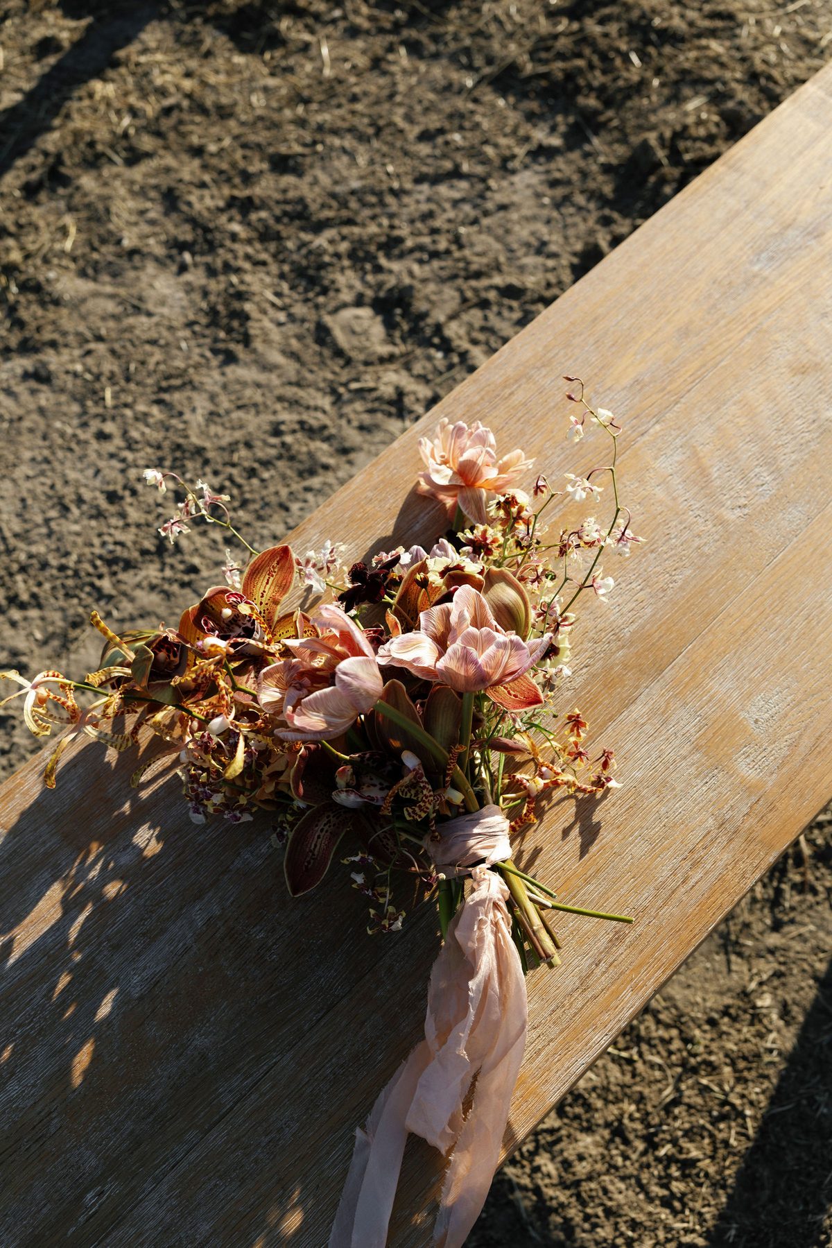 A bouquet resting on a ceremony bench