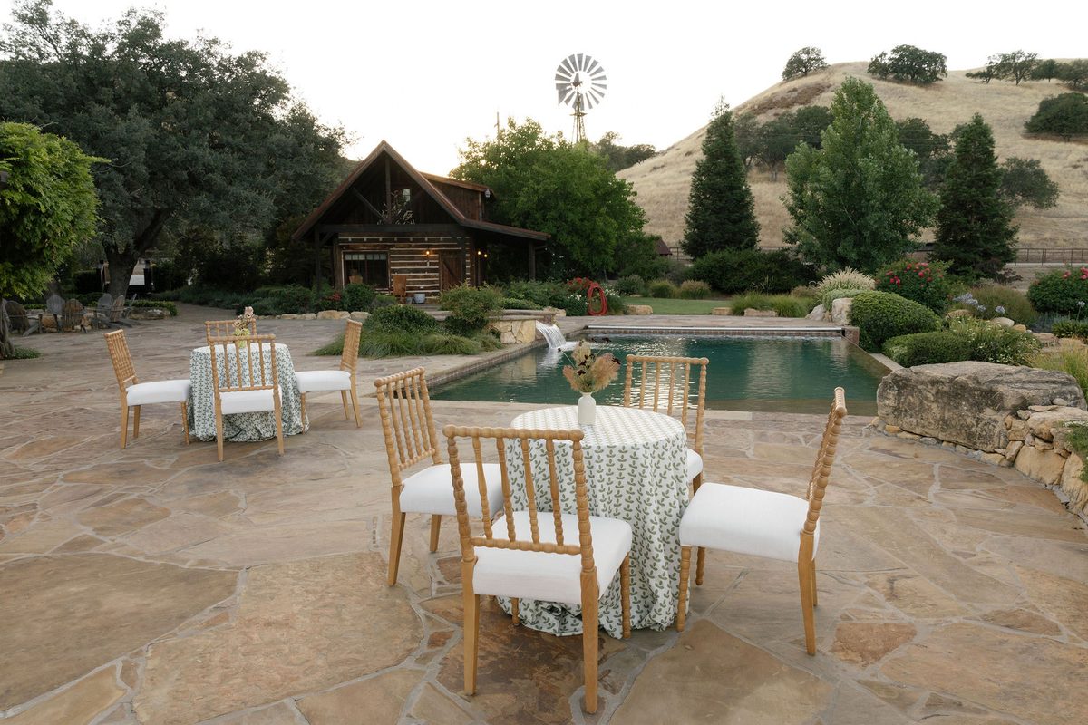 The stone pool terrace with the lodge and windmill beyond