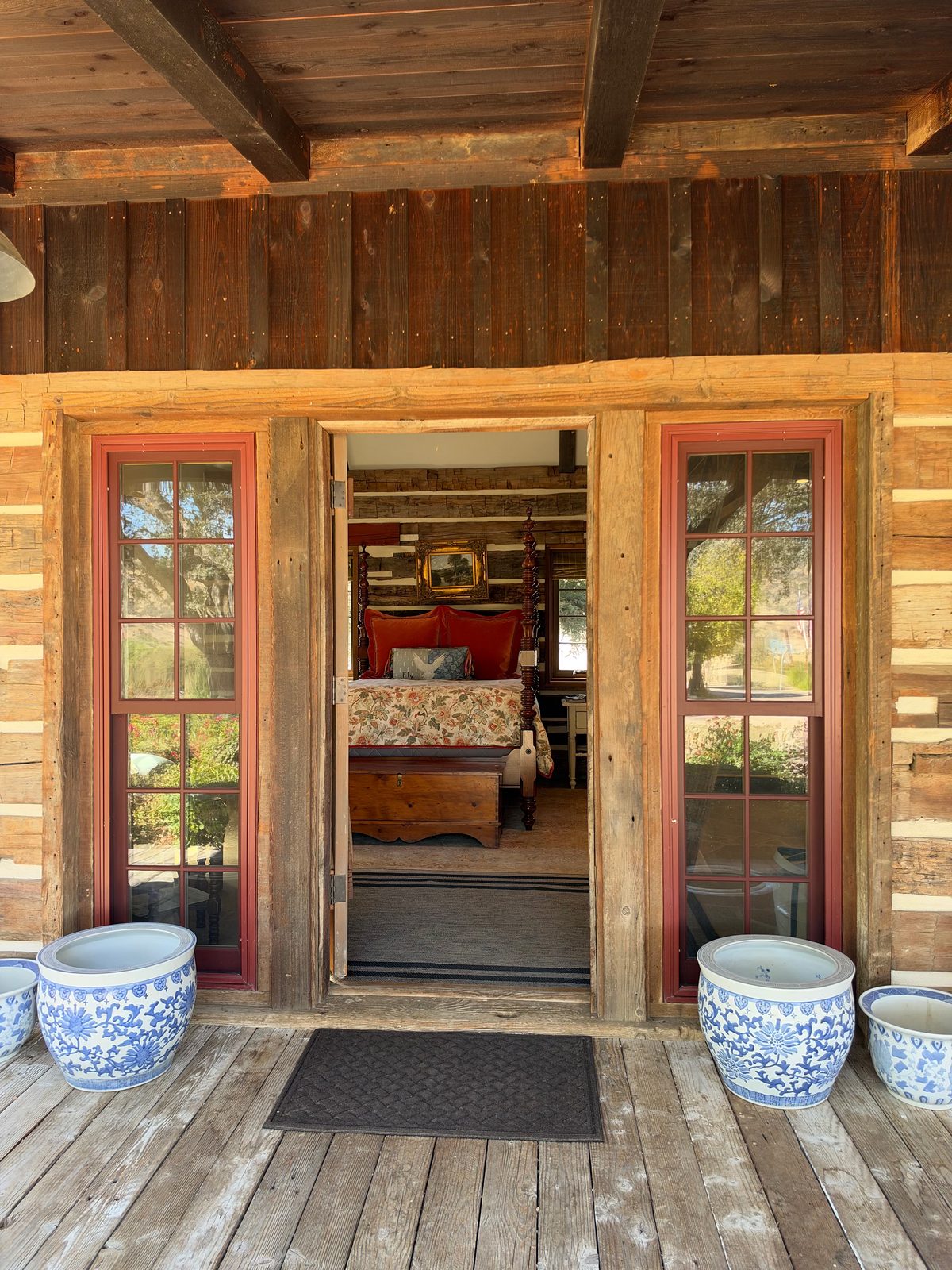 French doors open onto a cabin porch